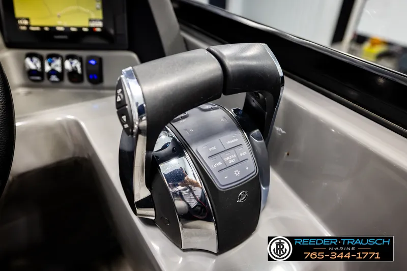 Slide: The Image of Throttle control panel of 2021 Avalon EXCALIBUR boat, featuring modern navigation and control buttons. - 38
