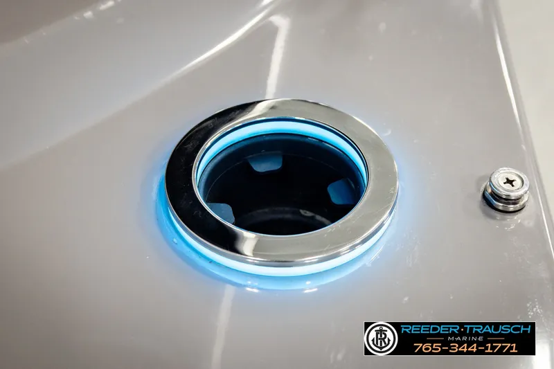 Slide: The Image of Close-up of illuminated cup holder on 2021 Avalon EXCALIBUR boat by Reeder-Trausch Marine. - 51