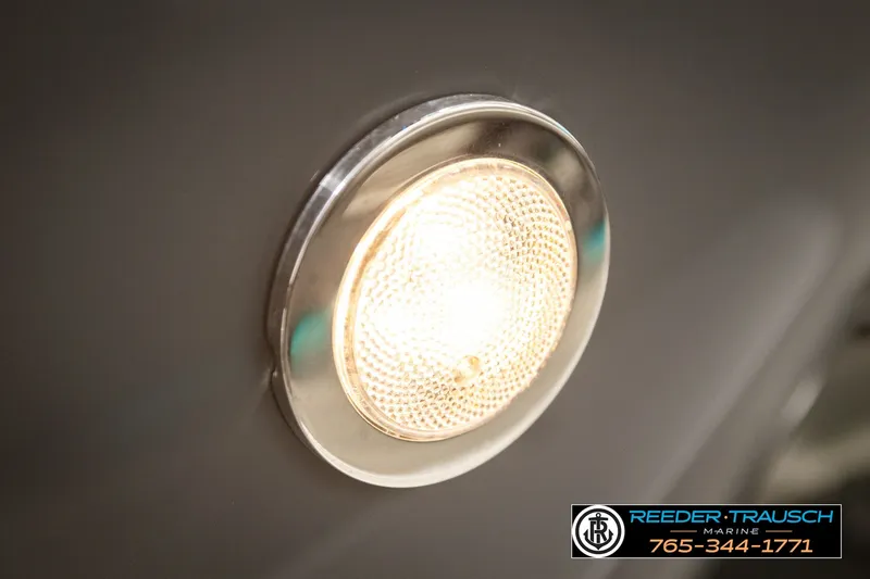 Slide: The Image of Close-up of a 2021 Avalon EXCALIBUR boat light with Reeder-Trausch Marine contact details. - 46