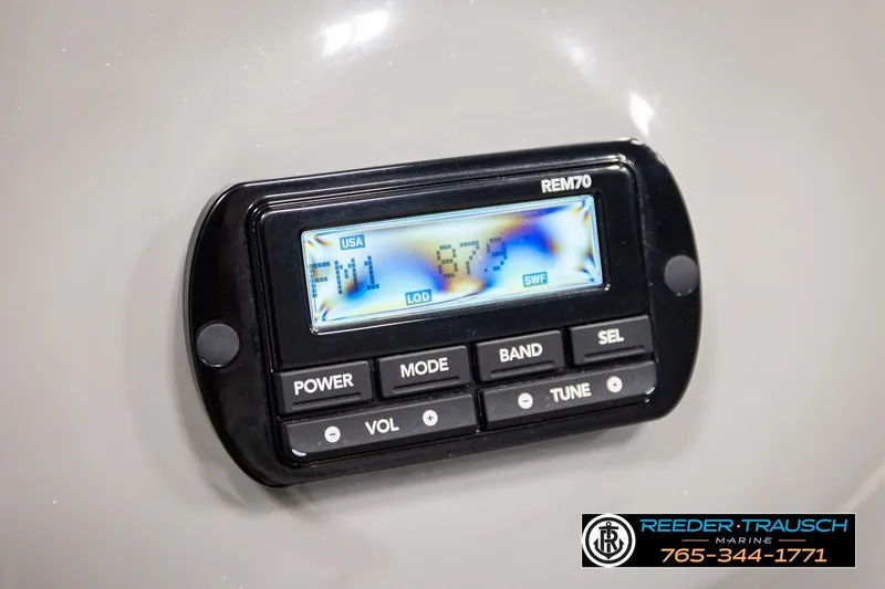 Slide: The Image of Control panel of Avalon EXCALIBUR 2021 boat with radio display and buttons. - 50