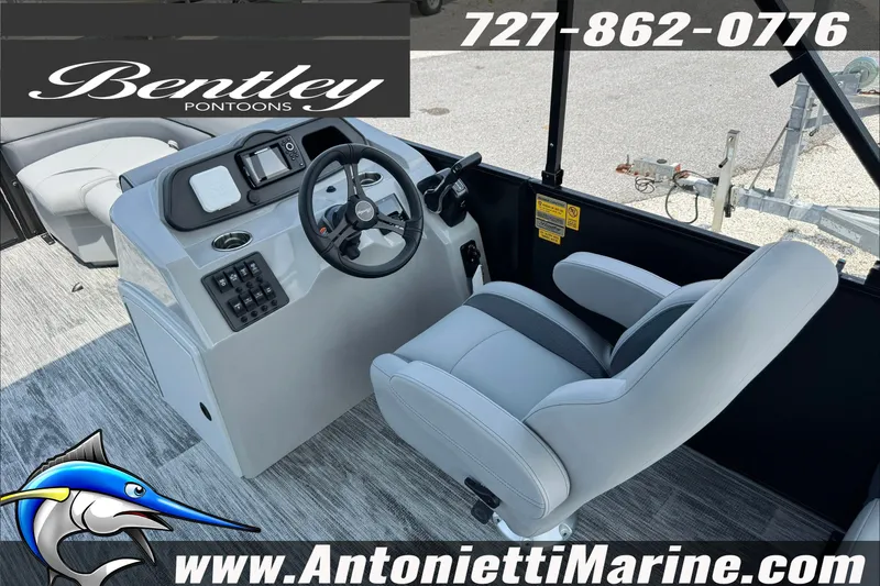 Slide: The Image of 2027 Bentley Pontoons Bolt 223 interior with steering console and plush seating. - 12