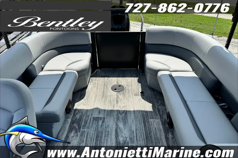 Slide: The Image of 2027 Bentley Pontoons Bolt 223 interior with gray seating and wood-style flooring. - 10