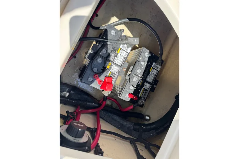 Slide: The Image of Battery compartment of a 2003 Searay 270 Sundeck boat with wiring connections. - 34