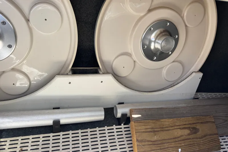 Slide: The Image of Storage compartment of a 2003 Searay 270 Sundeck boat with accessories and equipment. - 33