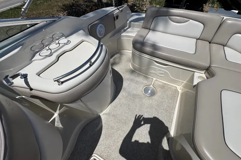 Slide: The Image of Interior of 2003 Searay 270 Sundeck boat with seating and cup holders. - 15