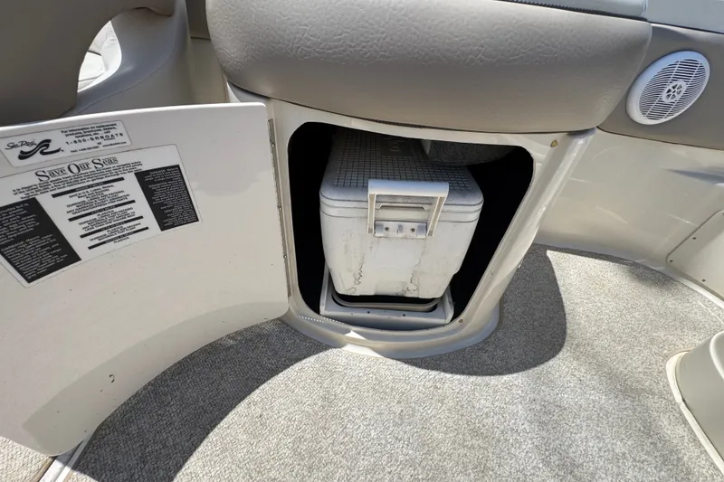 Slide: The Image of Storage compartment with cooler on a 2003 Searay 270 Sundeck boat interior. - 17