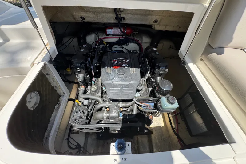 Slide: The Image of Engine compartment of a 2003 Searay 270 Sundeck boat, featuring a MerCruiser engine. - 28