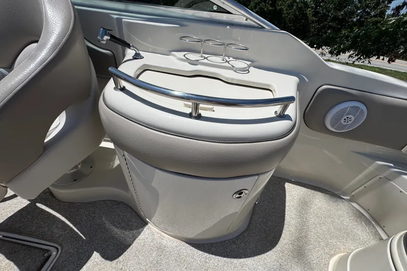 Slide: The Image of 2003 Searay 270 Sundeck interior with seating and built-in cup holders. - 16