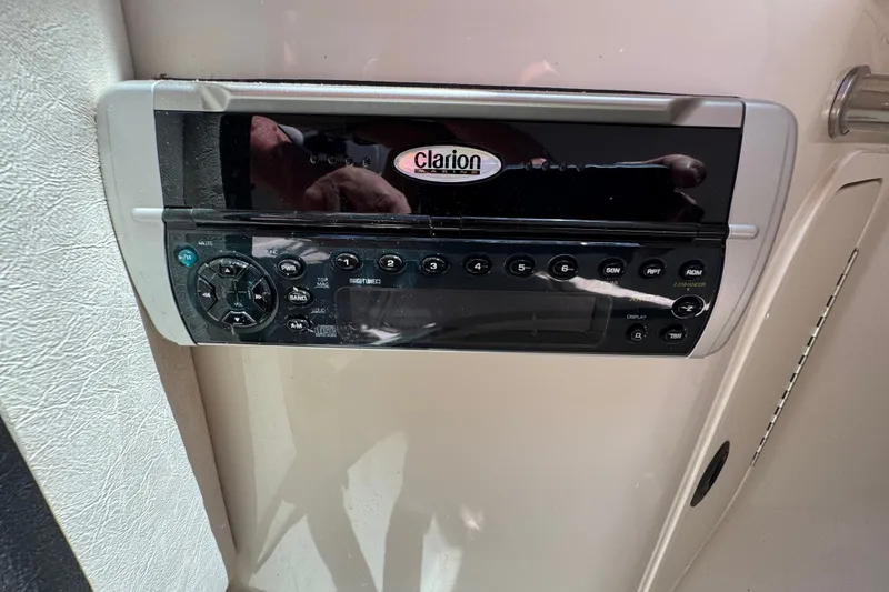 Slide: The Image of Clarion stereo system on 2003 Searay 270 Sundeck boat dashboard. - 36