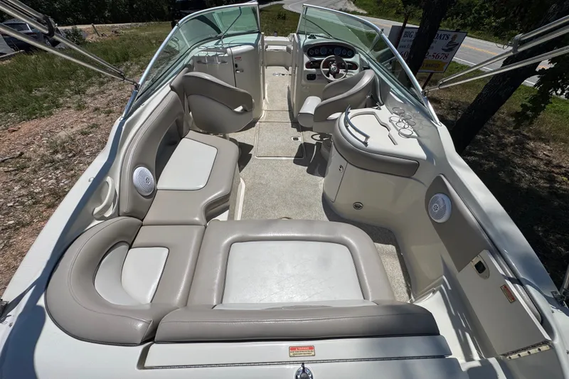 Slide: The Image of 2003 Searay 270 Sundeck boat interior with spacious seating and modern dashboard. - 8