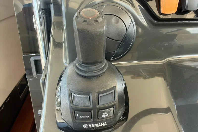 Slide: The Image of Joystick control on a 2017 Pursuit S 408 Sport boat, featuring Yamaha branding. - 52