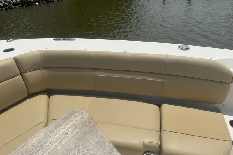 Slide: The Image of Luxurious seating on 2017 Pursuit S 408 Sport boat, overlooking calm waters. - 36