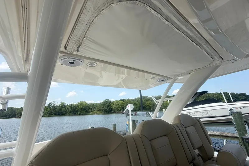Slide: The Image of Interior view of 2017 Pursuit S 408 Sport boat with seating and canopy. - 58
