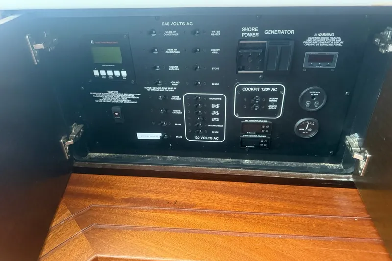 Slide: The Image of Electrical control panel on a 2017 Pursuit S 408 Sport boat. - 53