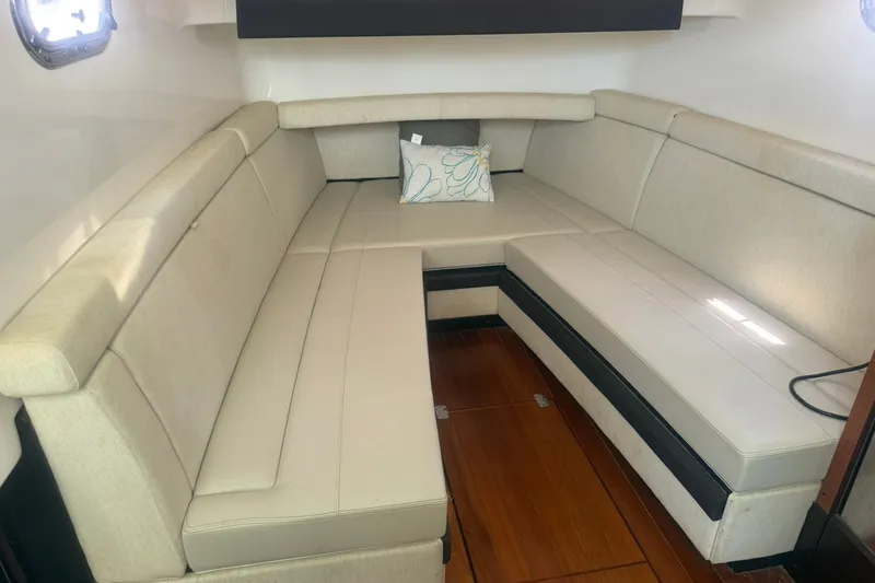 Slide: The Image of Luxurious interior seating of 2017 Pursuit S 408 Sport boat with beige upholstery. - 44
