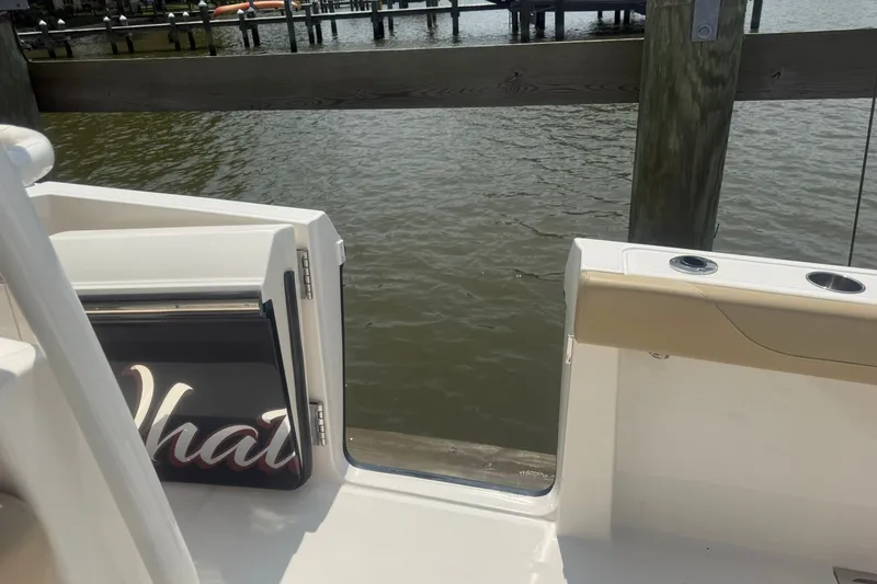 Slide: The Image of 2017 Pursuit S 408 Sport boat with open side door, dockside view. - 30