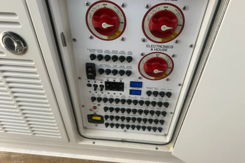 Slide: The Image of Control panel of a 2017 Pursuit S 408 Sport boat with switches and dials. - 49