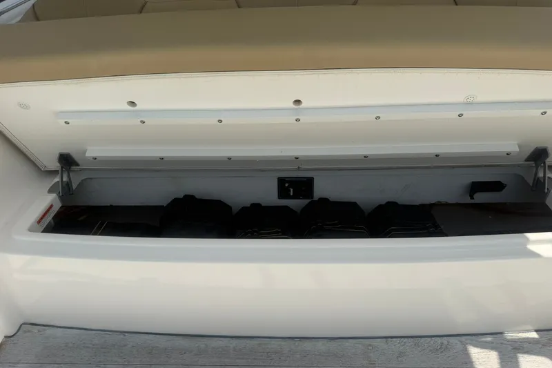 Slide: The Image of Storage compartment of a 2017 Pursuit S 408 Sport boat, open and empty. - 32