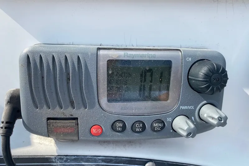 Slide: The Image of Raymarine marine radio on 2010 Boston Whaler 190 Outrage boat dashboard. - 12