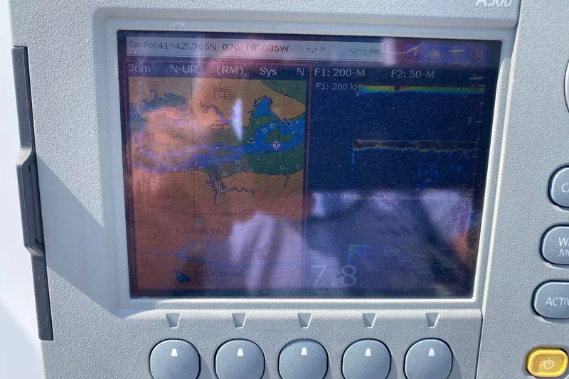 Slide: The Image of Boat navigation system displaying map and sonar on a 2010 Boston Whaler 190 Outrage. - 11