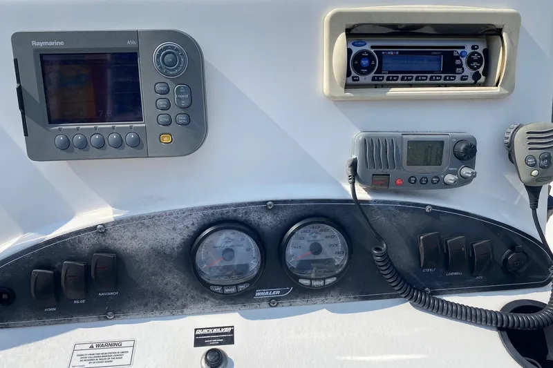 Slide: The Image of Dashboard of a 2010 Boston Whaler 190 Outrage with navigation and communication equipment. - 10