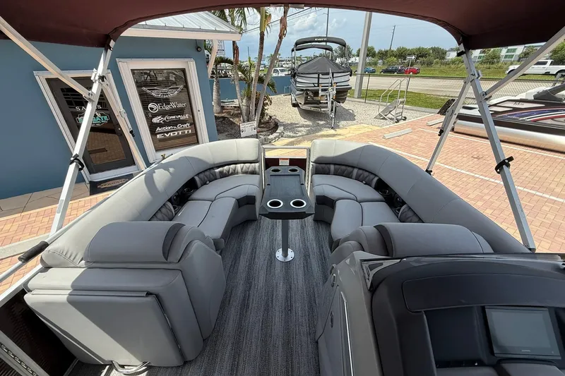 Slide: The Image of 2023 Bennington 23 LXFB pontoon boat with spacious seating and modern design. - 22