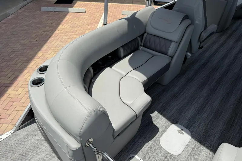 Slide: The Image of Luxurious seating on 2023 Bennington 23 LXFB pontoon boat with gray upholstery and cup holders. - 9