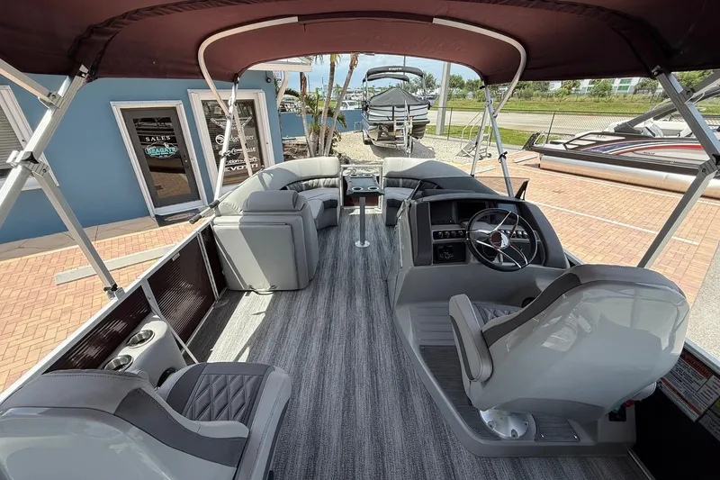 Slide: The Image of Interior view of 2023 Bennington 23 LXFB pontoon boat with seating and steering console. - 13