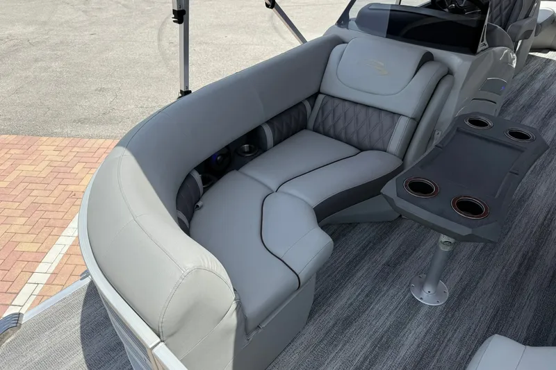Slide: The Image of Luxurious seating on 2023 Bennington 23 LXFB pontoon boat with cup holders and sleek design. - 26