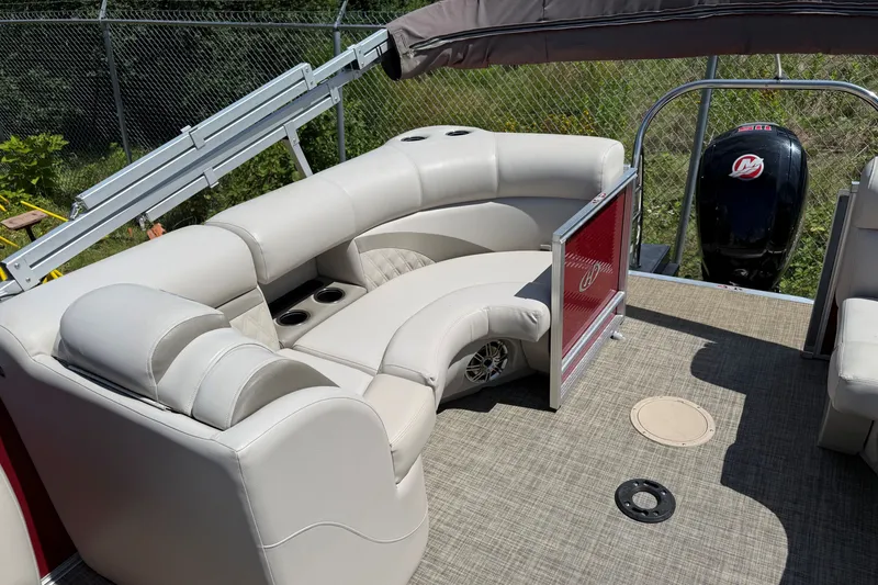 Slide: The Image of 2018 Harris Sunliner 220 pontoon boat with plush seating and modern design. - 11