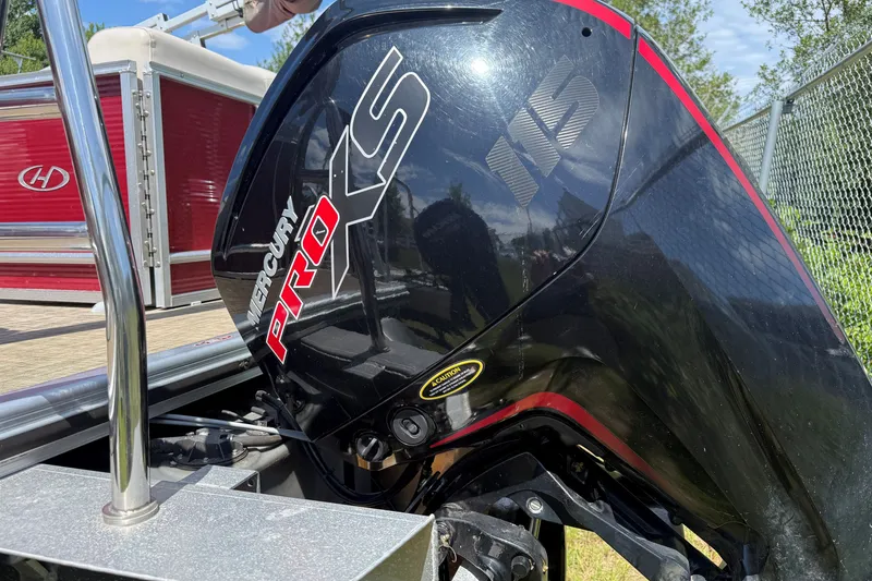 Slide: The Image of 2018 Harris Sunliner 220 with Mercury Pro XS 115 outboard motor, red and black design. - 5