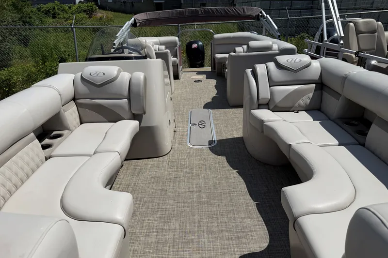 Slide: The Image of 2018 Harris Sunliner 220 pontoon boat with spacious seating and elegant interior design. - 6