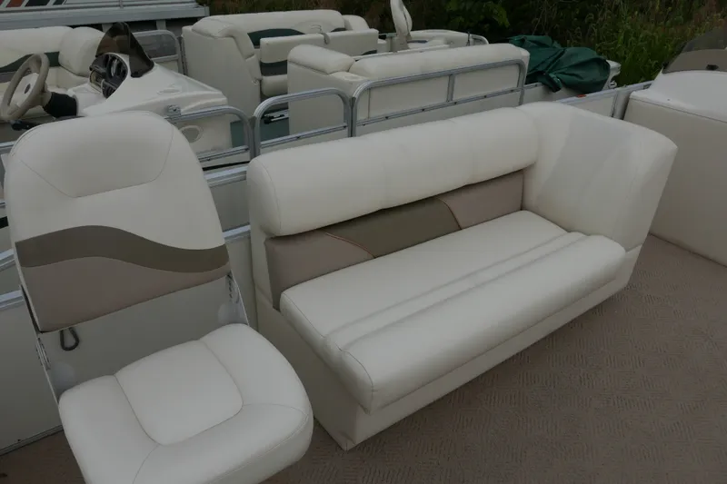 Slide: The Image of 2006 Crest 22 Super Sport boat interior with white seating and steering wheel. - 5