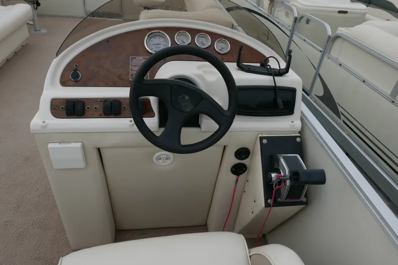 Slide: The Image of Steering console of a 2006 Crest 22 Super Sport boat with gauges and controls. - 10