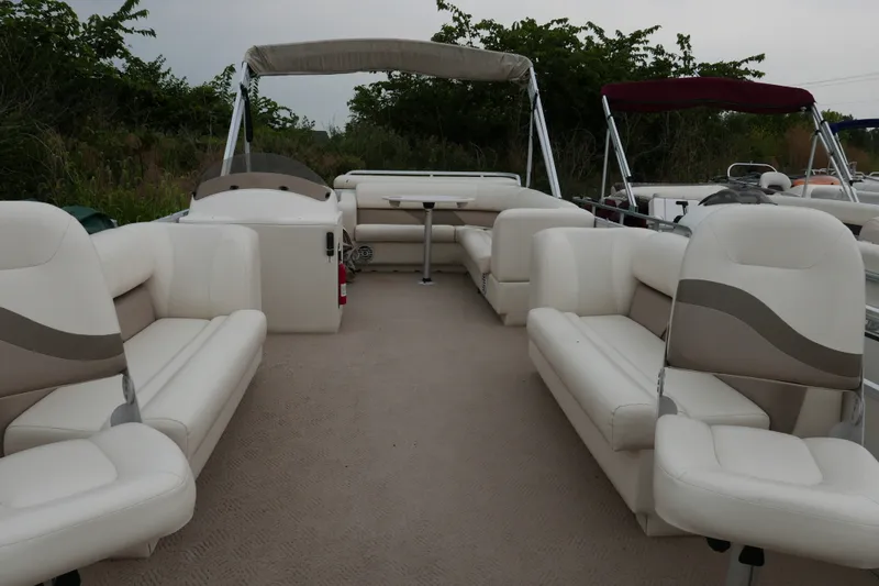 Slide: The Image of 2006 Crest 22 Super Sport pontoon boat with spacious seating and canopy. - 4
