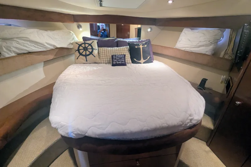 Slide: The Image of Cozy bedroom in 2006 Meridian 341 Sedan yacht with nautical-themed pillows. - 30