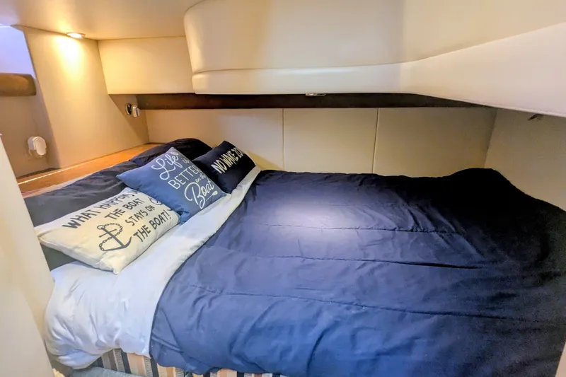 Slide: The Image of Cozy bedroom in 2006 Meridian 341 Sedan yacht with nautical-themed pillows and soft lighting. - 36