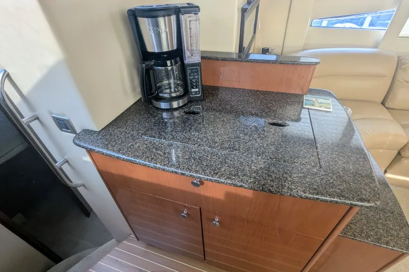 Slide: The Image of 2006 Meridian 341 Sedan interior with granite countertop and coffee maker. - 26