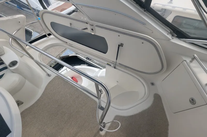 Slide: The Image of Interior view of a 2006 Meridian 341 Sedan yacht, featuring a hatch and seating area. - 18