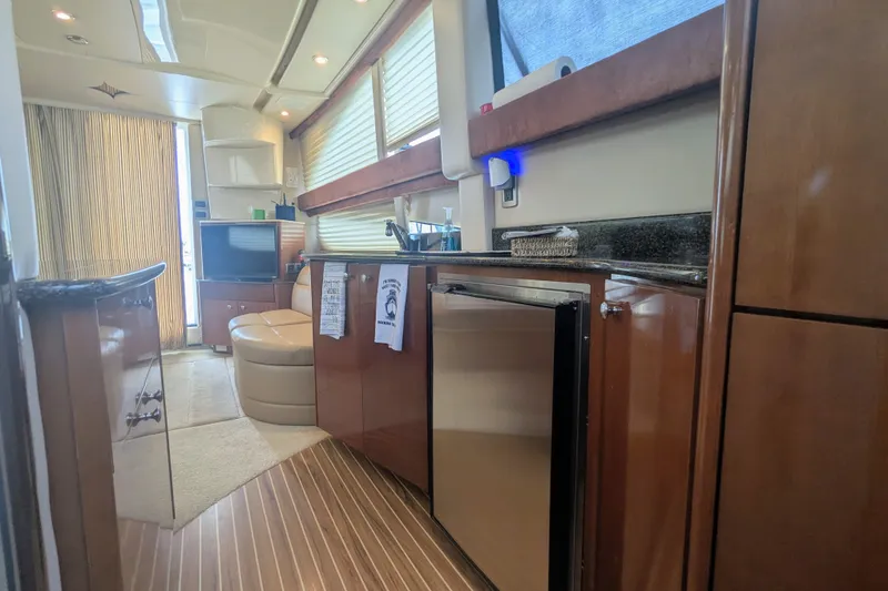 Slide: The Image of Interior of a 2006 Meridian 341 Sedan yacht with modern amenities and wood finishes. - 29