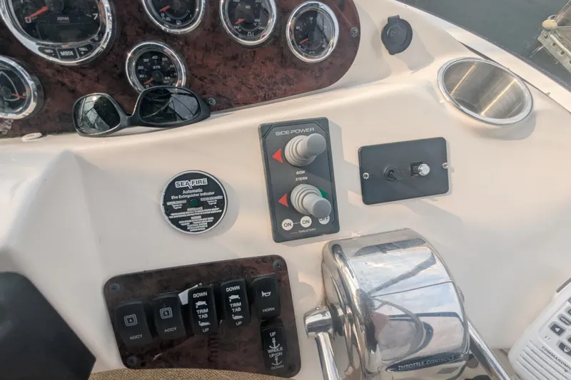 Slide: The Image of Control panel of a 2006 Meridian 341 Sedan boat with gauges and switches. - 15