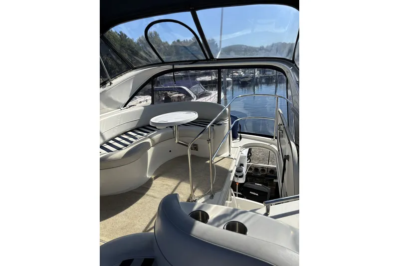 Slide: The Image of Interior view of a 2006 Meridian 341 Sedan yacht with seating and table. - 16