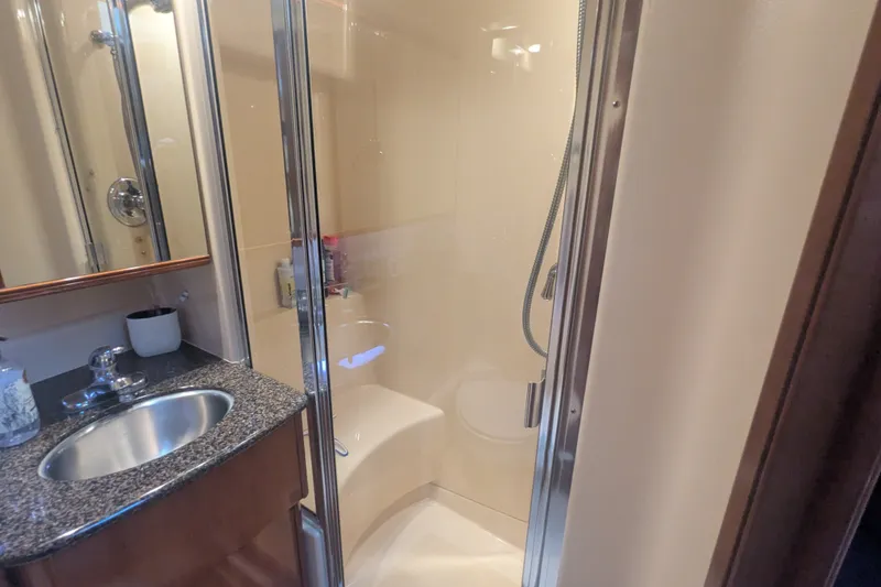 Slide: The Image of Luxurious bathroom in 2006 Meridian 341 Sedan yacht with shower and sink. - 35