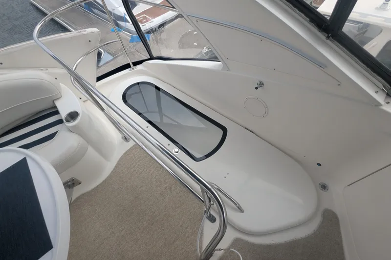 Slide: The Image of Interior view of a 2006 Meridian 341 Sedan yacht, featuring sleek seating and modern design. - 17