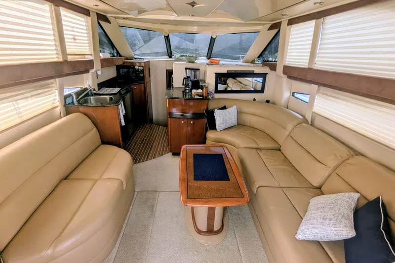 Slide: The Image of Luxurious interior of a 2006 Meridian 341 Sedan yacht with plush seating and modern amenities. - 19