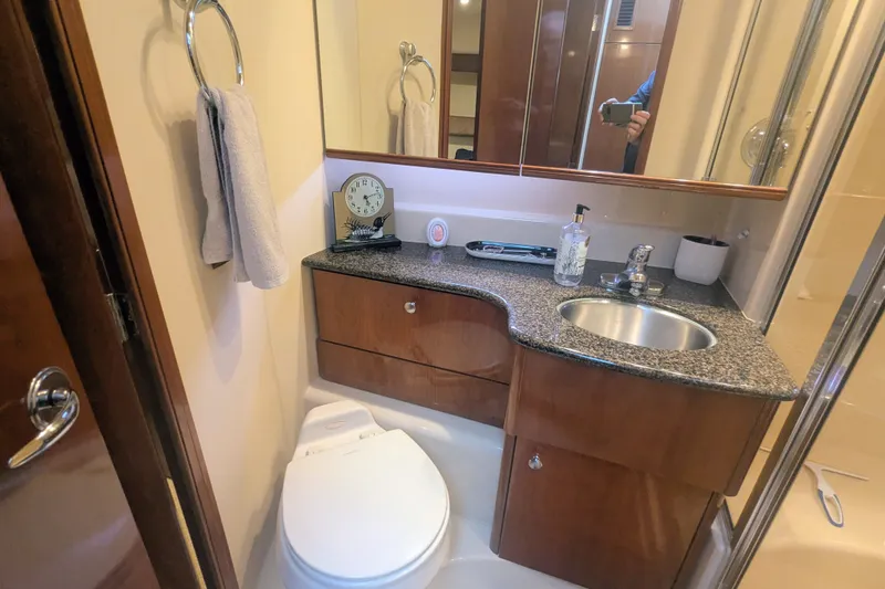 Slide: The Image of Luxurious bathroom in 2006 Meridian 341 Sedan yacht with granite countertop and modern fixtures. - 33