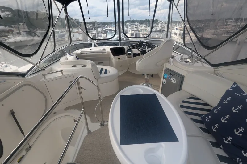 Slide: The Image of Luxurious interior of a 2006 Meridian 341 Sedan yacht with elegant seating and helm. - 12