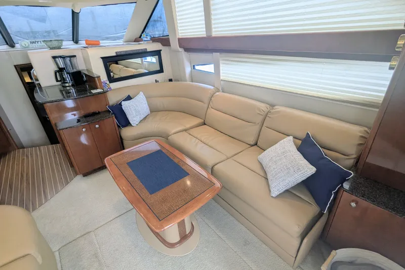 Slide: The Image of Luxurious interior of a 2006 Meridian 341 Sedan yacht with beige leather seating. - 20