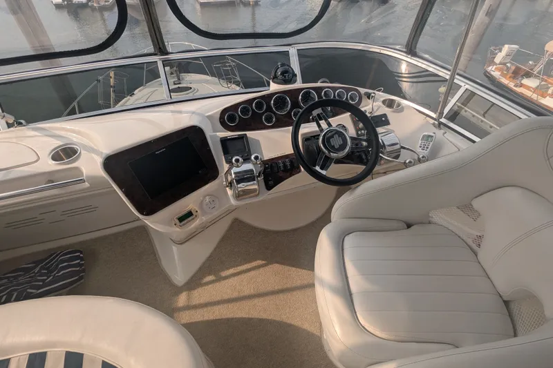 Slide: The Image of Interior helm of 2006 Meridian 341 Sedan yacht with steering wheel and controls. - 9