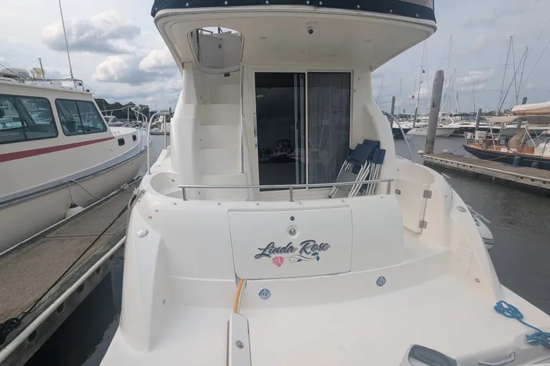 Slide: The Image of 2006 Meridian 341 Sedan yacht docked at marina, featuring "Linda Rose" nameplate. - 4